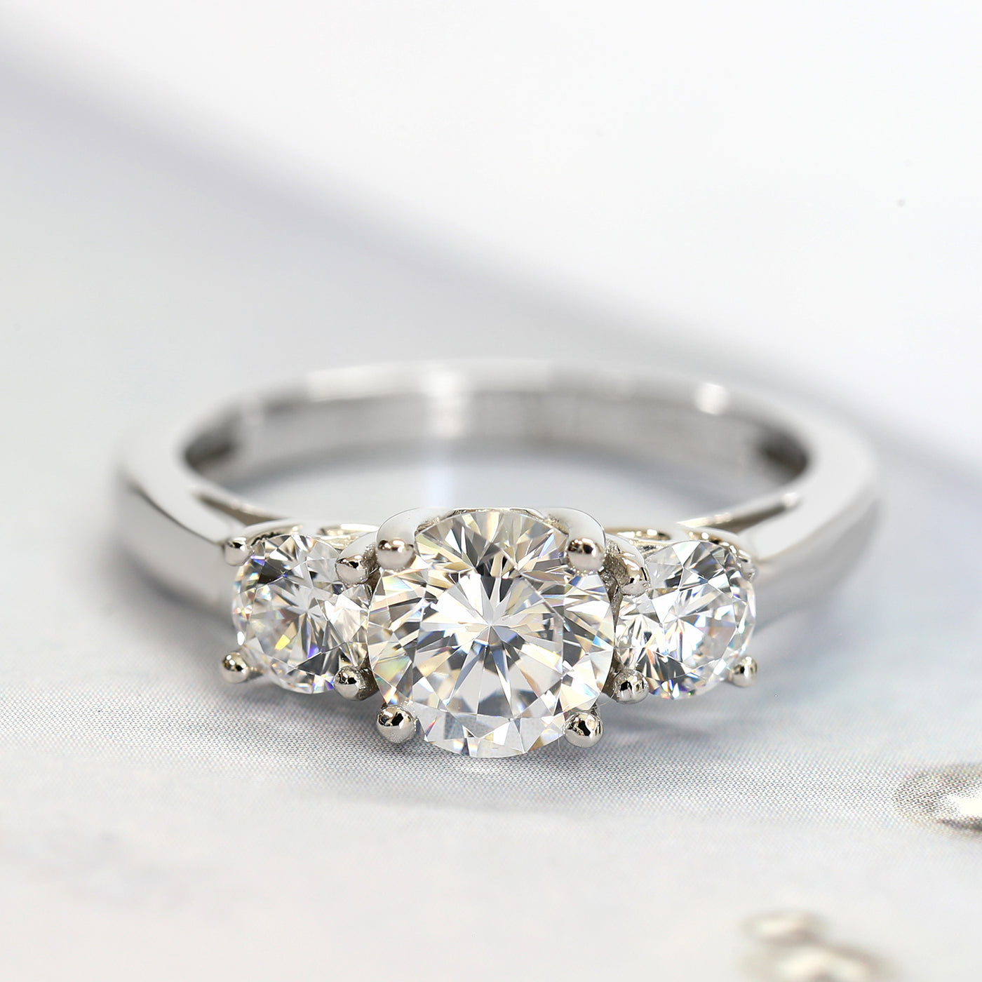 Rhodium-plated sterling silver three-stone ring with 1ct center cubic zirconia and two 0.25ct side stones — Trinity Grace Ring