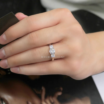 Close-up of a hand wearing a diamond ring with 'Double Accent' branding.
