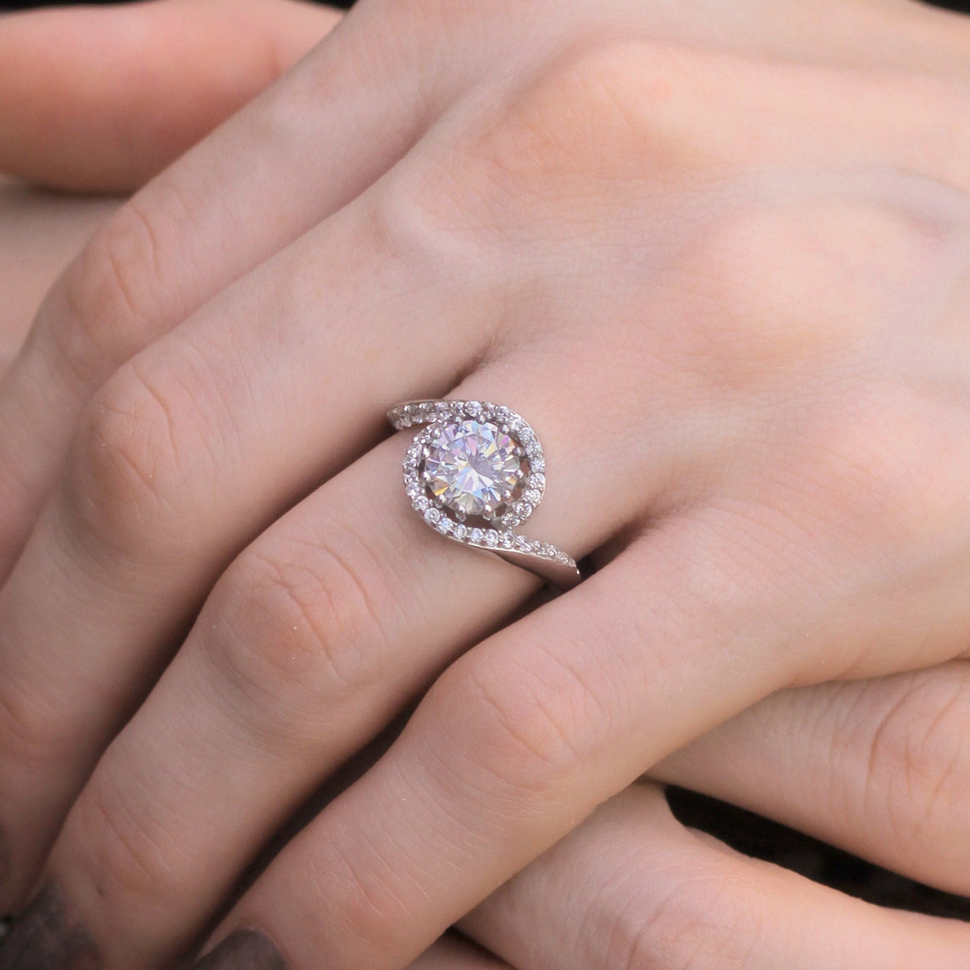Hand wearing Seraphic Swirl Ring showing bypass design.