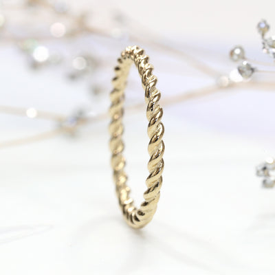Thin 14K gold twisted rope stackable ring close-up