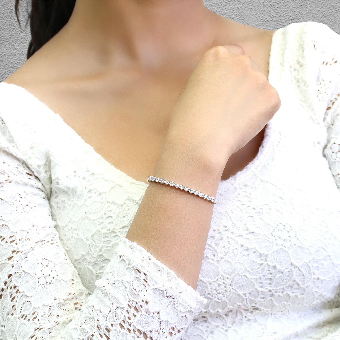 Woman adjusting sliding clasp on Gentle Fit Bracelet