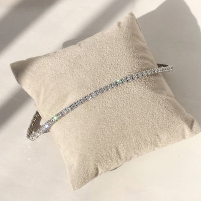 Inner Radiance Tennis Bracelet in platinum-plated silver with moissanite, flat view.