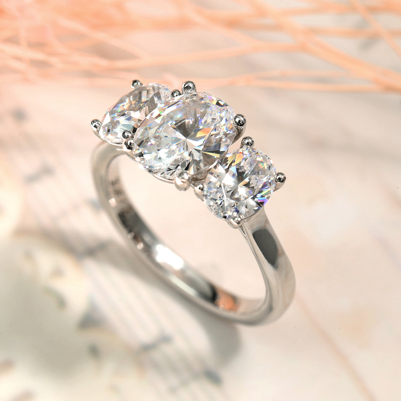 Unmatched Brilliance: Oval Grace Three Stone Ring
